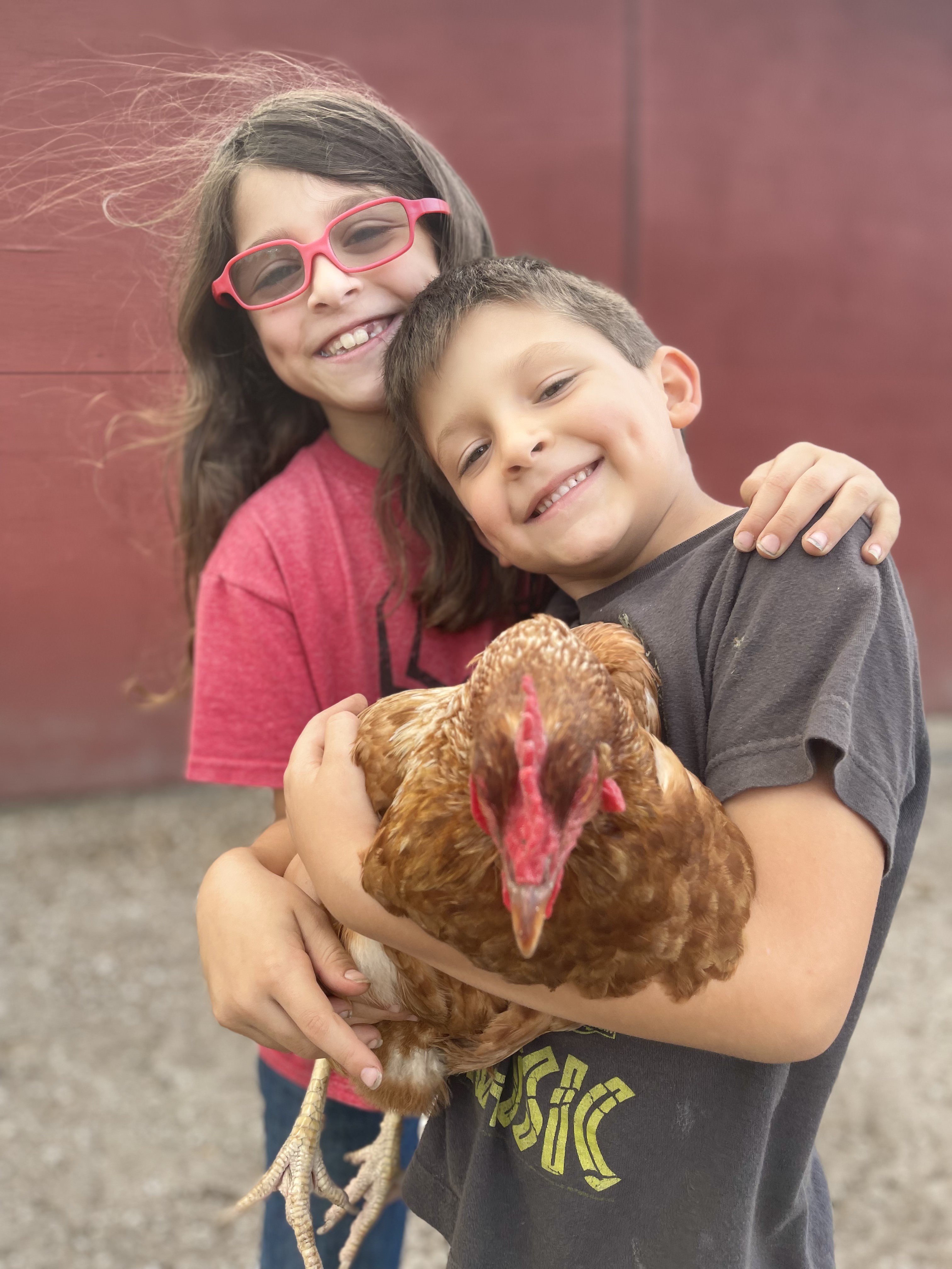Acton Academy Alva hero caring for goats